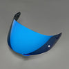 A bright blue replacement helmet visor with a curved shape and anti-fog coating.
