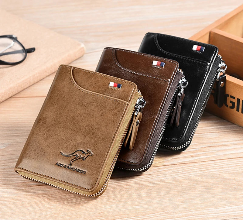 A brown leather wallet with a zipper and flag detail is shown next to a black version on a wooden surface.