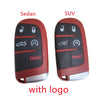 Two red key fob shells, one for a Sedan and one for a SUV, featuring a panic button and logo.