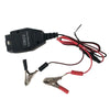 An OBD2 battery memory saver device with a digital display and attached wires.