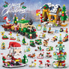A set of Christmas advent calendar building blocks featuring a decorated house, a sleigh, and various festive figures.