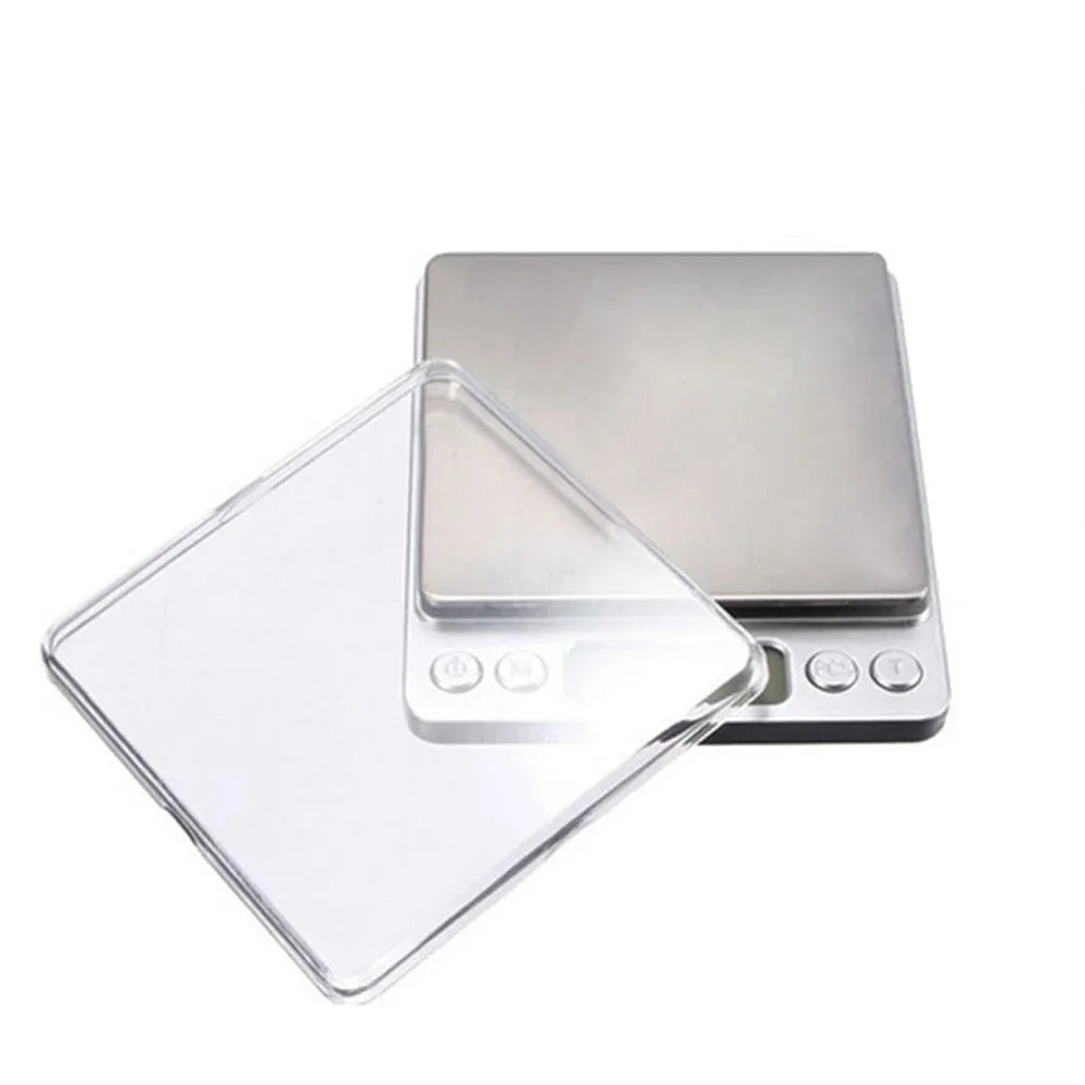 A silver digital pocket scale with a clear plastic tray is shown from above.