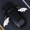 A black Toyota 4Runner is shown with white bat-shaped LED door logos and a light projector on the hood.