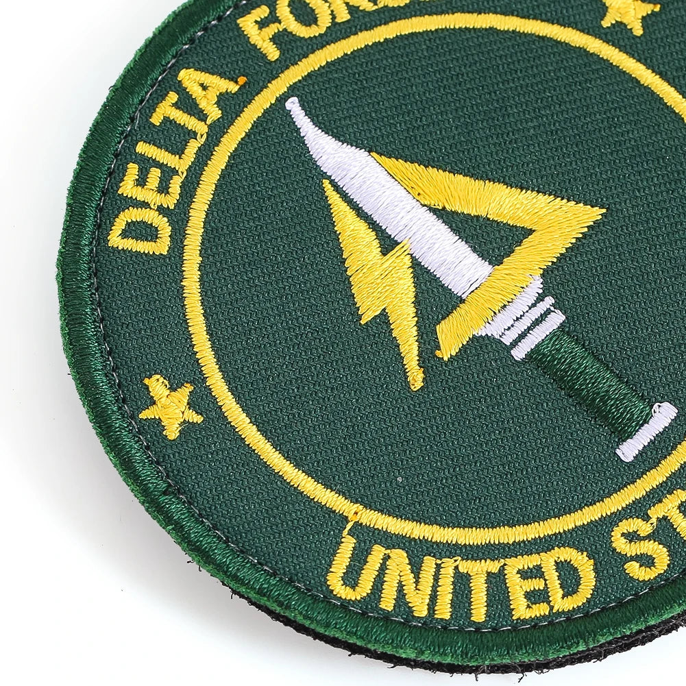 Dark green embroidered patch featuring a yellow lightning bolt design and text on the edge.