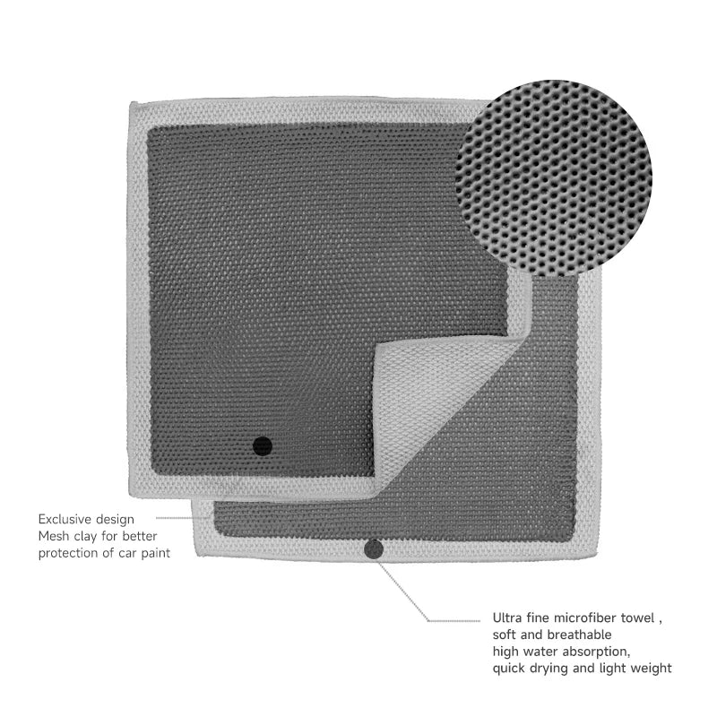 A gray microfiber detailing towel with a circular pad for cleaning car paint.
