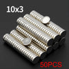 A collection of 50 small silver disc magnets arranged in a 10 by 3 grid.