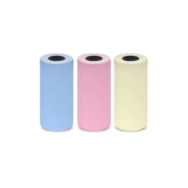 Three rolls of portable Bluetooth thermal printer paper in blue, pink, and cream colors.