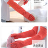 A pair of orange silicone scrubbing gloves are shown being used to clean a sink or dish.