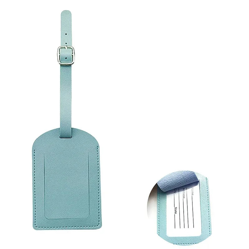 A light blue PU leather luggage tag with a strap, featuring a rectangular design and embossed text.