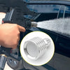 A hand is attaching a stainless steel high-pressure washer nozzle with a 1/4 quick connect to a vehicle's exterior.