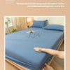 A close-up of a blue fitted bed sheet being pulled and released to demonstrate the elastic design.
