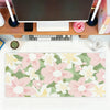 A pink and green floral mouse pad featuring various flowers for office or gaming use.
