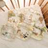 A collection of soft cotton waterproof baby bibs with adjustable necks featuring woodland animal illustrations.