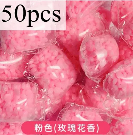50 pieces of pink water-soluble laundry fragrance beads in clear plastic packaging