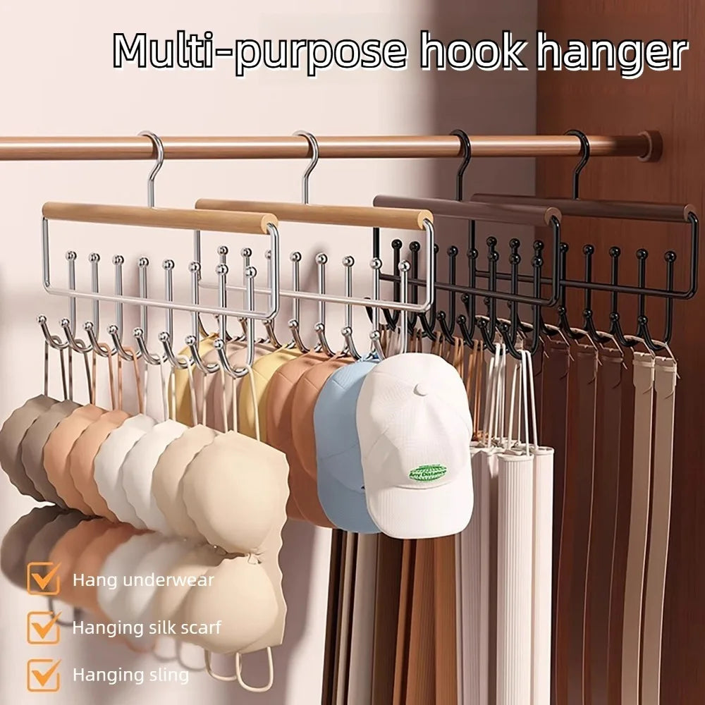 Multi-purpose hook hanger rack displaying various clothing items like shirts and scarves on a wooden rod.