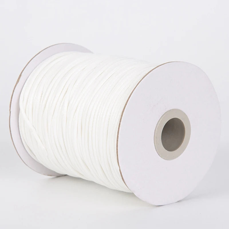 A roll of white waxed cord rope for jewelry making and DIY projects.