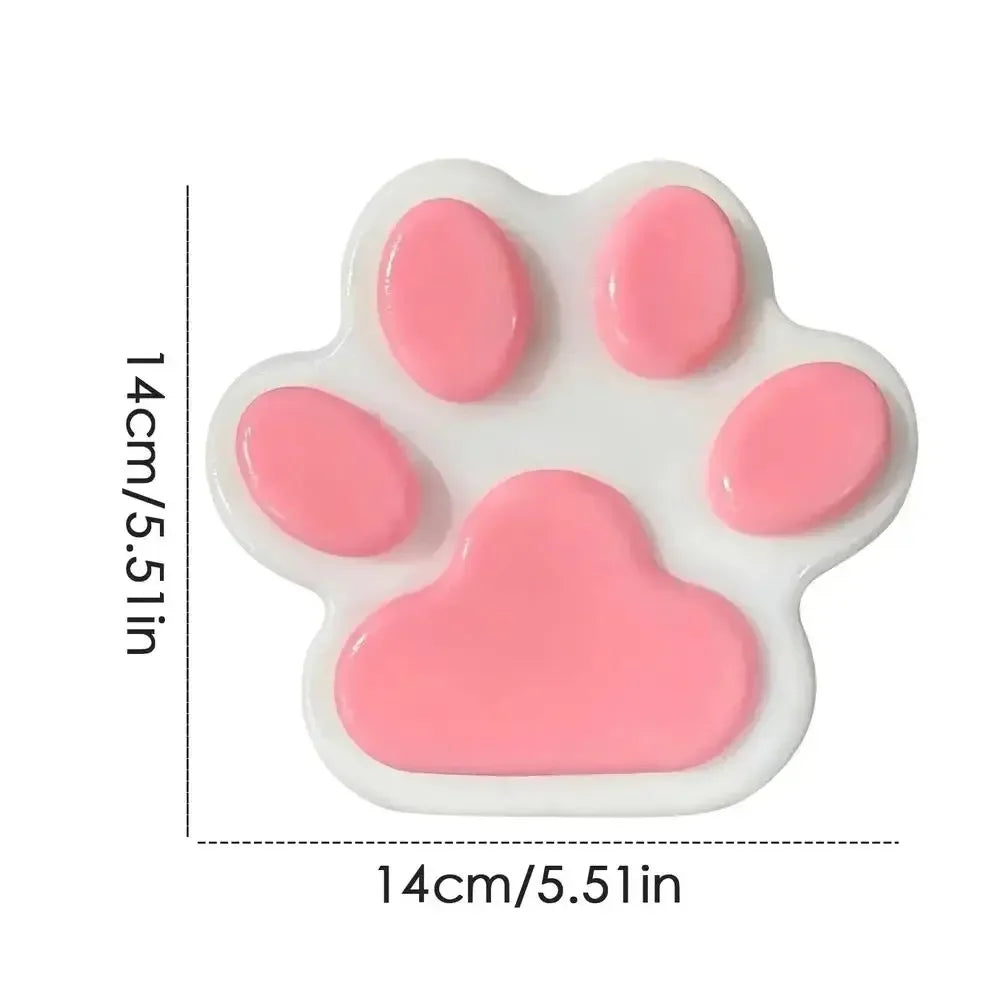 A pink soft sticky cat paw squeeze toy for stress relief and fidgeting.