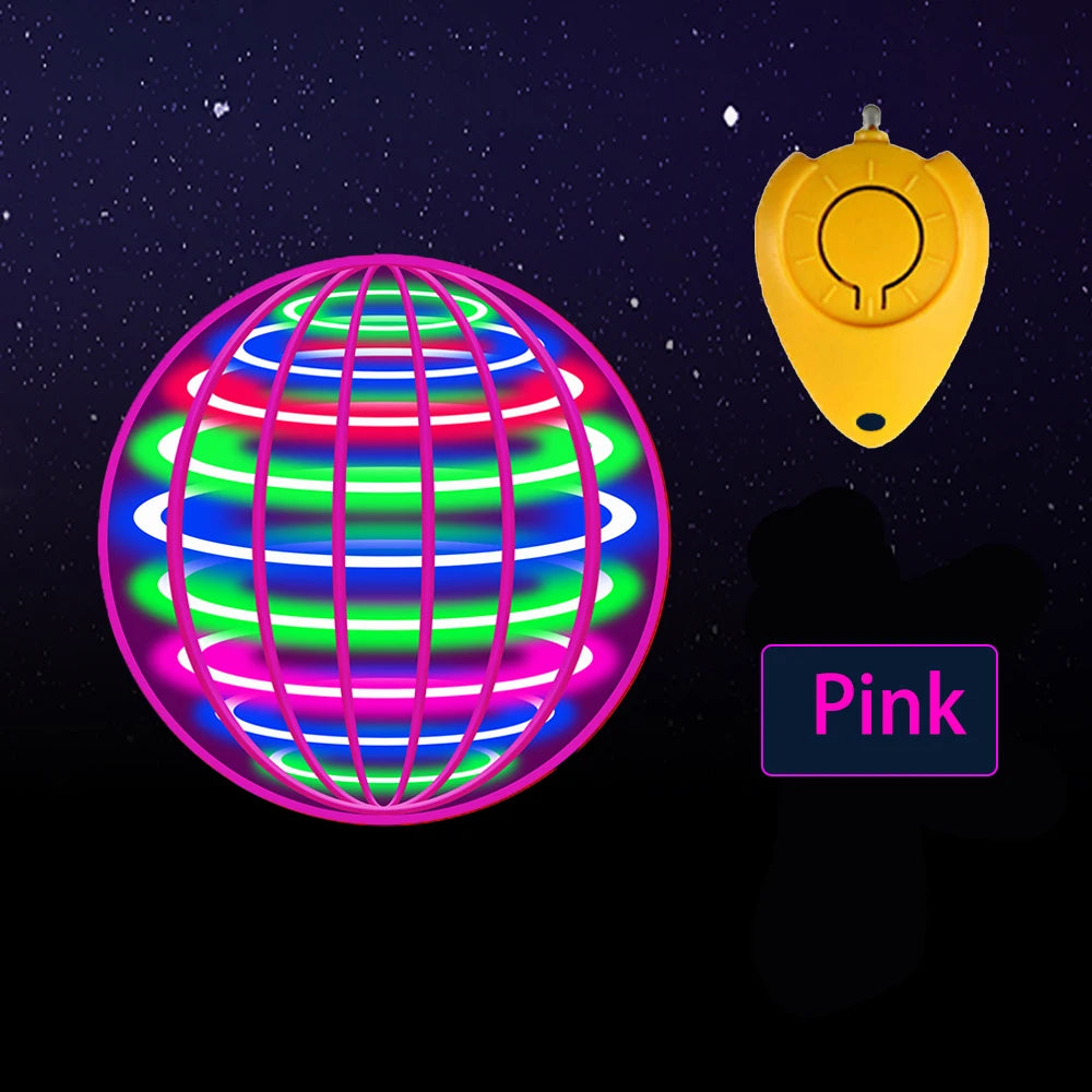 A pink spinning globe toy with multiple colored LED lights and a yellow remote control.
