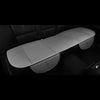 A gray breathable PU leather car seat cover is shown placed on a black car seat interior.