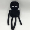 A black soft plush doll resembling a Minecraft character with a square white eye and limbs.