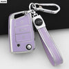 A silver car key cover with a purple grip and a metal clip is shown against a white background.