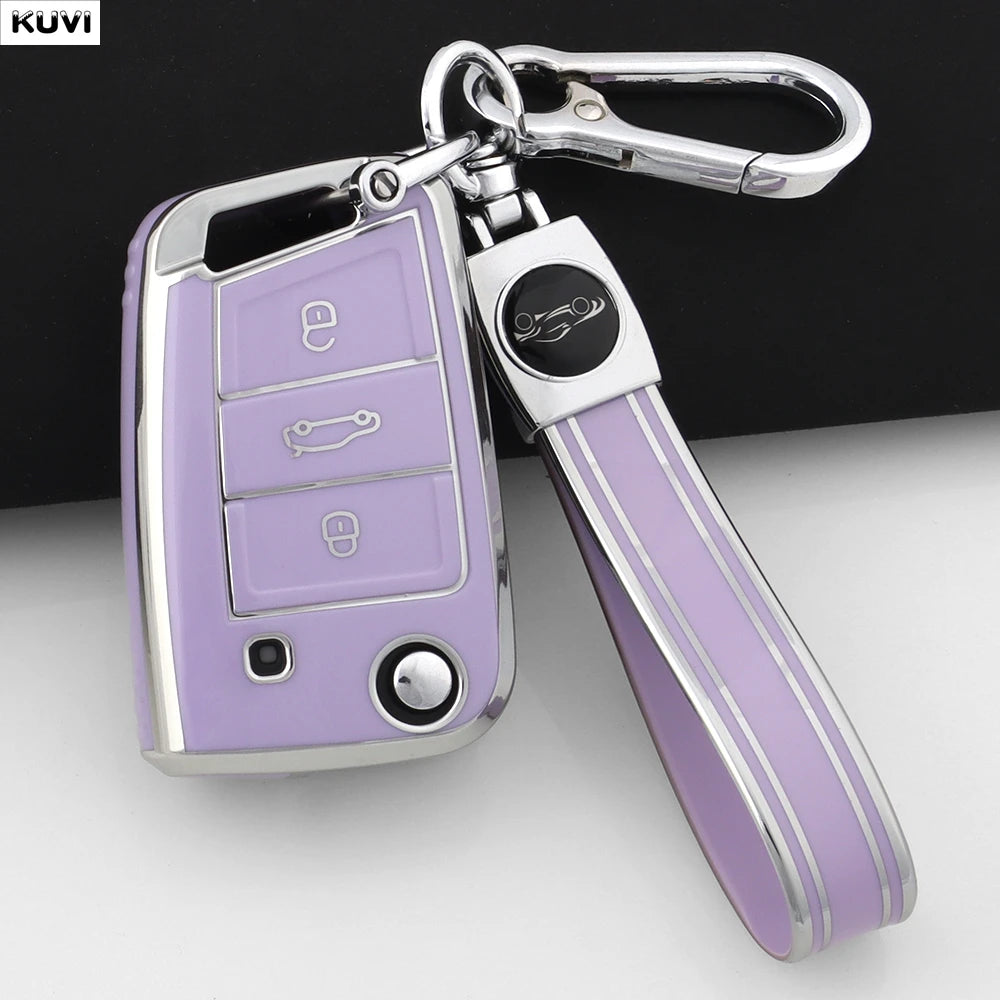 A silver car key cover with a purple grip and a metal clip is shown against a white background.