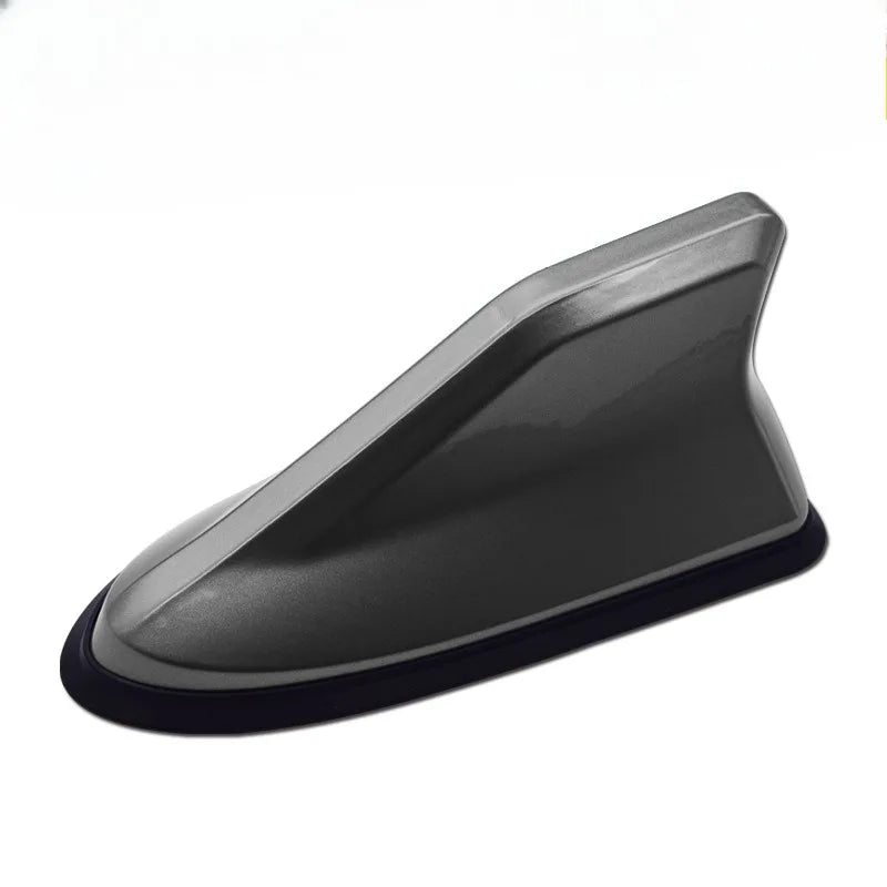 Gray aerodynamic shark fin car antenna with signal amplifier