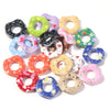 A collection of colorful acrylic spacer beads in various wave patterns and colors for jewelry making