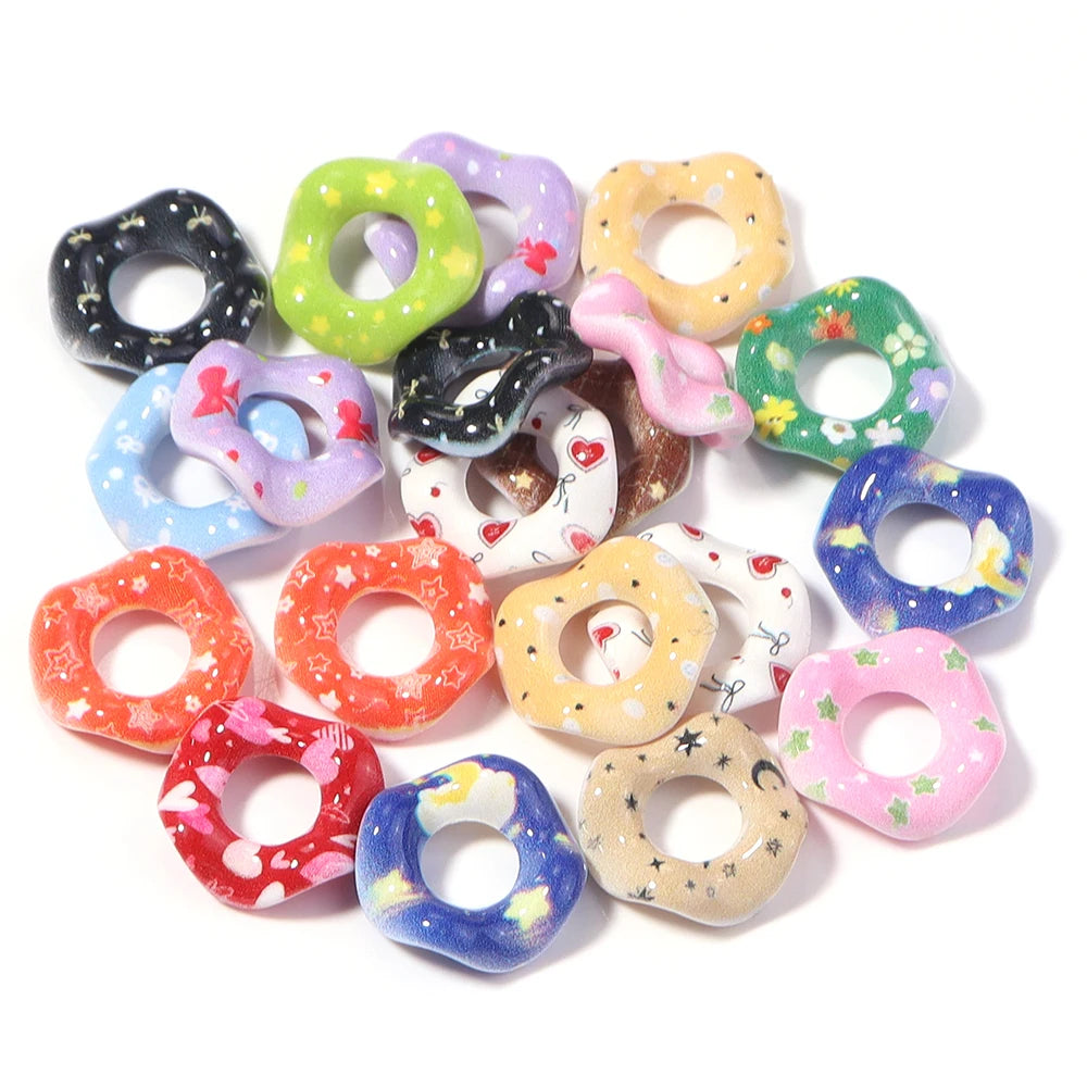 A collection of colorful acrylic spacer beads in various wave patterns and colors for jewelry making