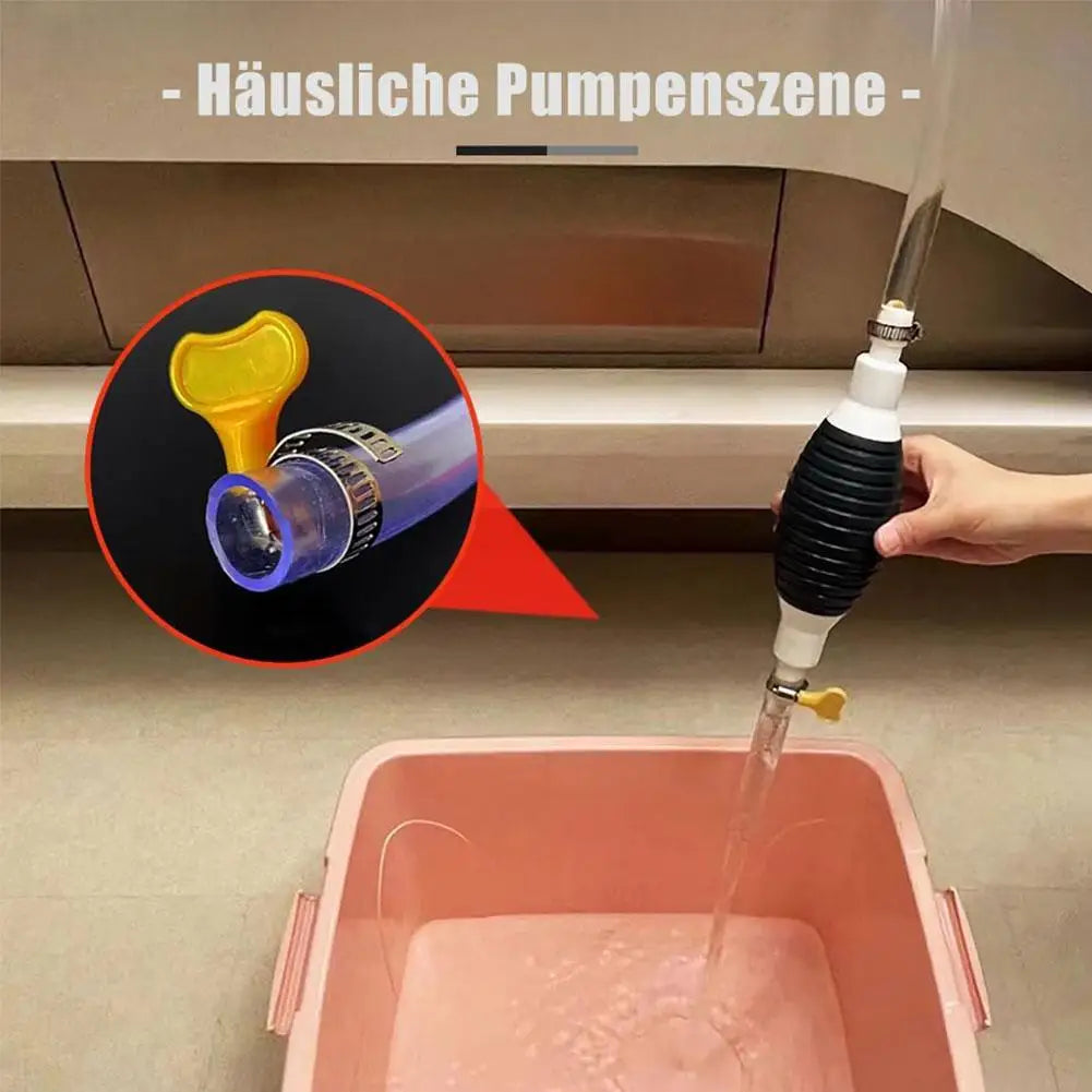 A close-up of a portable siphon pump kit with a yellow component and a clear hose being used to draw liquid into a pink conta