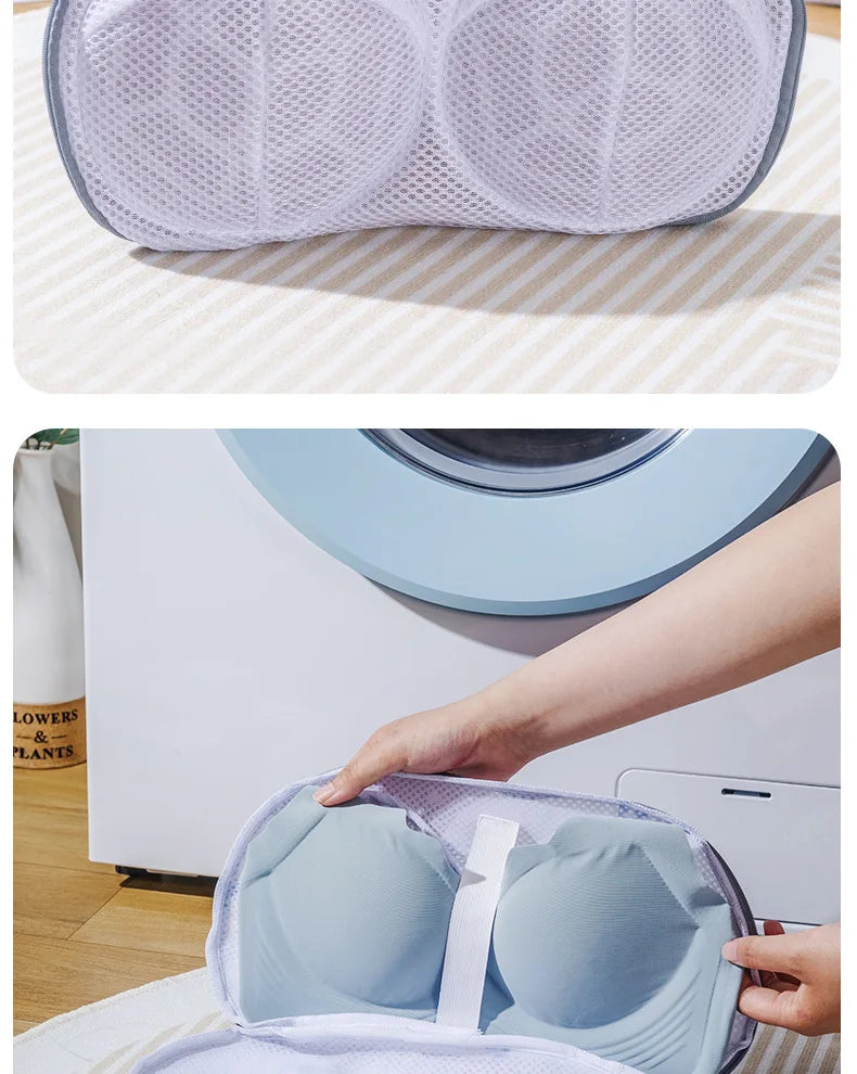 A hand places a light blue mesh laundry bag for delicates onto a white washing machine.