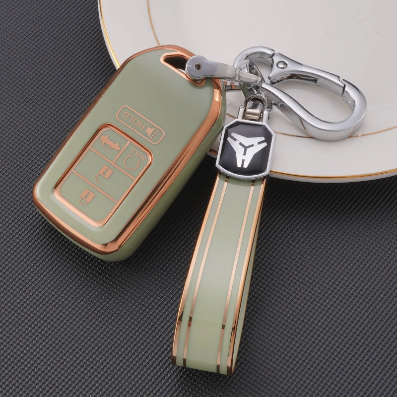 A light green TPU protective key case with a silver clip and leather strap is shown resting on a white surface.