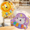 A yellow lion-shaped finger piano toy and a purple unicorn-shaped finger piano toy for early education.