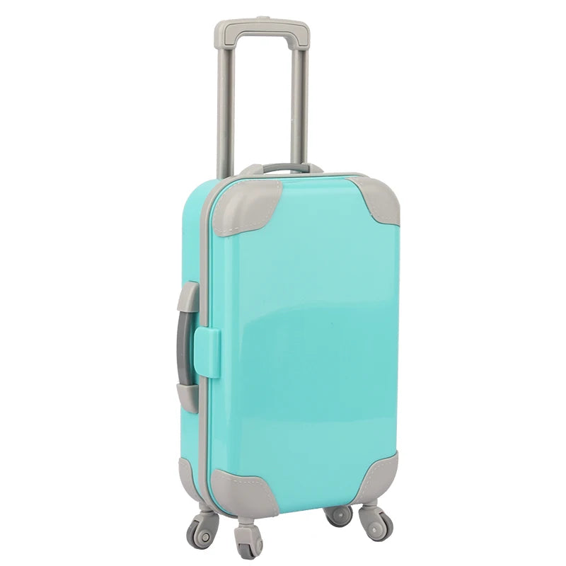 A light blue and gray doll travel suitcase with a handle and wheels.