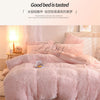 A pink plush mink velvet duvet cover set displayed on a bed with white curtains.