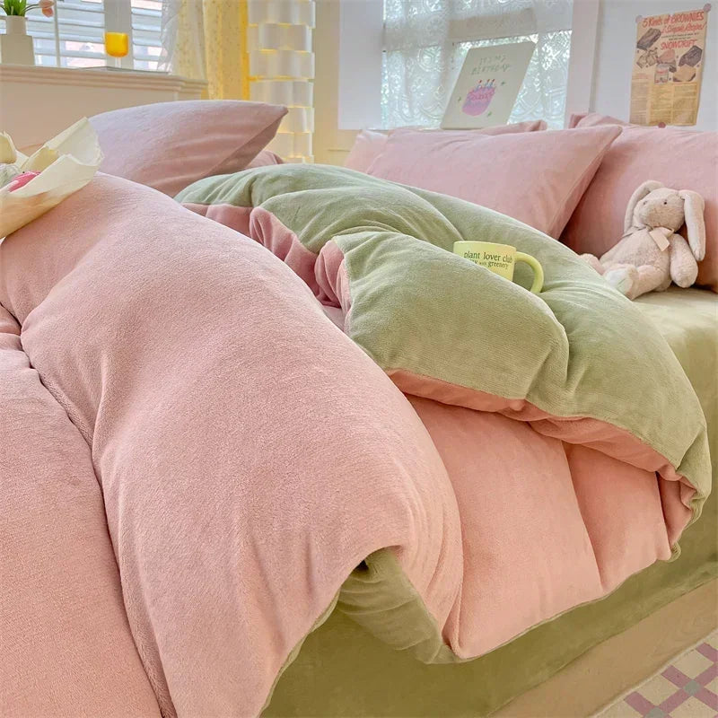 Pink and green velvet bedding set featuring a duvet cover and pillows in a bright room.