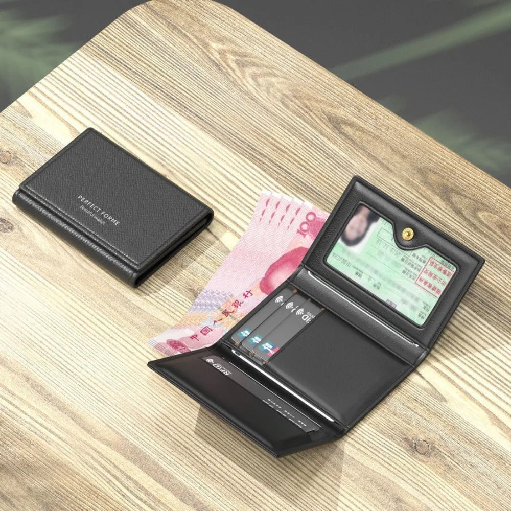 A black leather card holder wallet with multiple slots is displayed on a wooden surface.