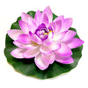 A vibrant pink lotus flower with purple accents rests on a green leaf.