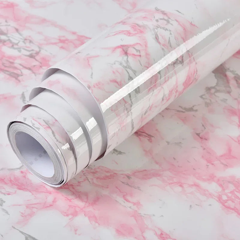 Roll of self-adhesive pink marble wallpaper for furniture and countertops