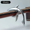 A silvery shark-design guitar capo with a zinc alloy build is shown mounted on a wooden neck.