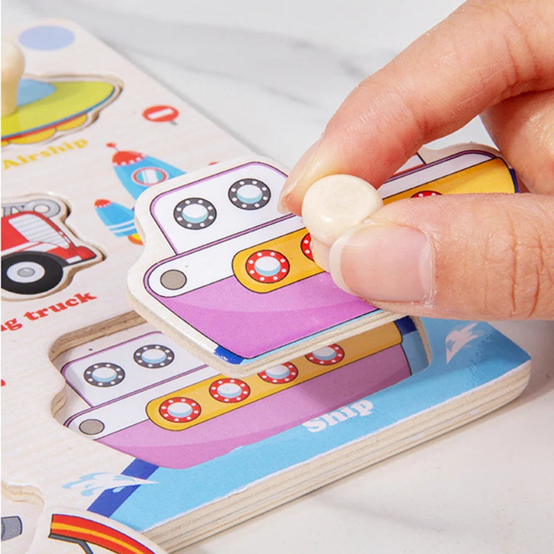 A hand is placing a wooden 3D jigsaw puzzle piece featuring a pink vehicle onto a larger puzzle board.