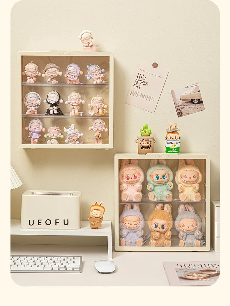 A wall-mounted display case holds various collectible dolls and figurines in an organized arrangement.