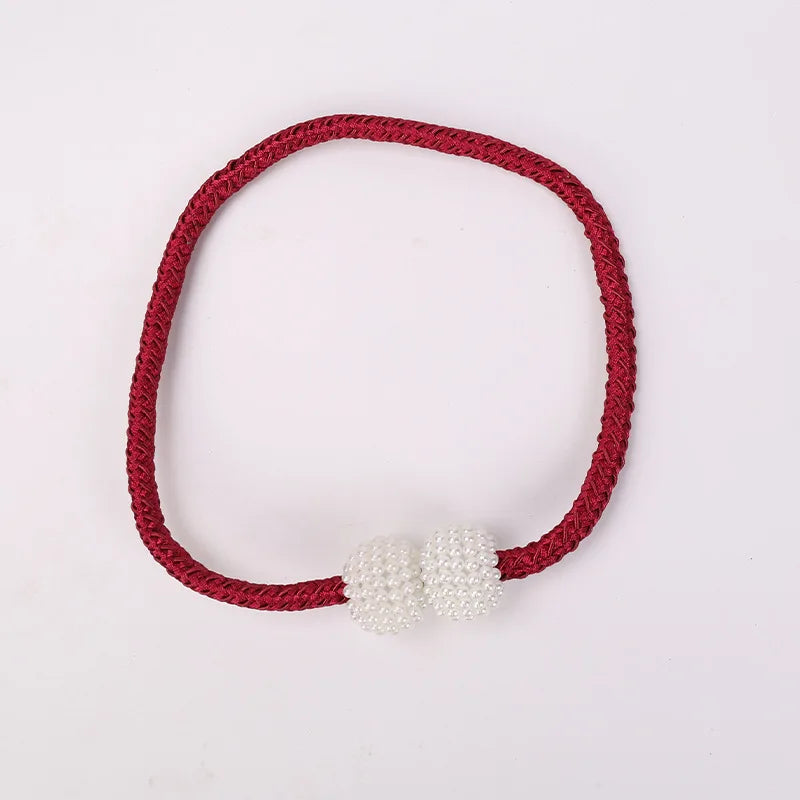 A set of eight red cord tie-back clips with pearl magnetic closures.