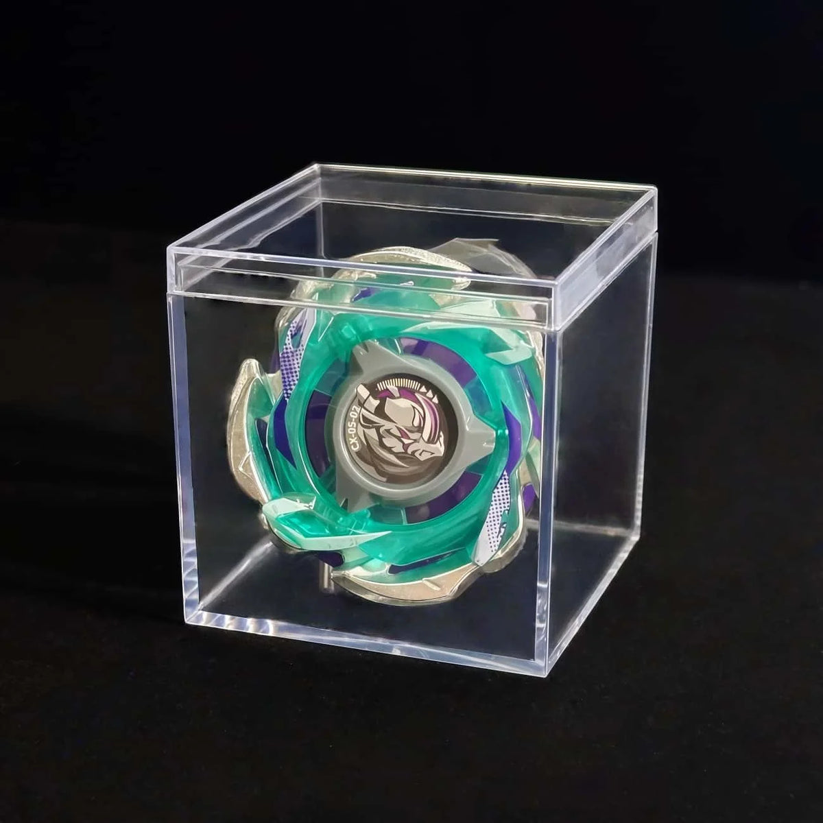 A Valkyrie Volt S4-70V metal spinning top with launcher displayed inside a clear plastic box.