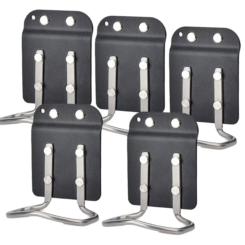 A set of black clip-on tool belt holsters designed for securing drills and power tools.