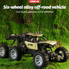 A yellow and black six-wheel alloy off-road RC vehicle galloping on green grass.