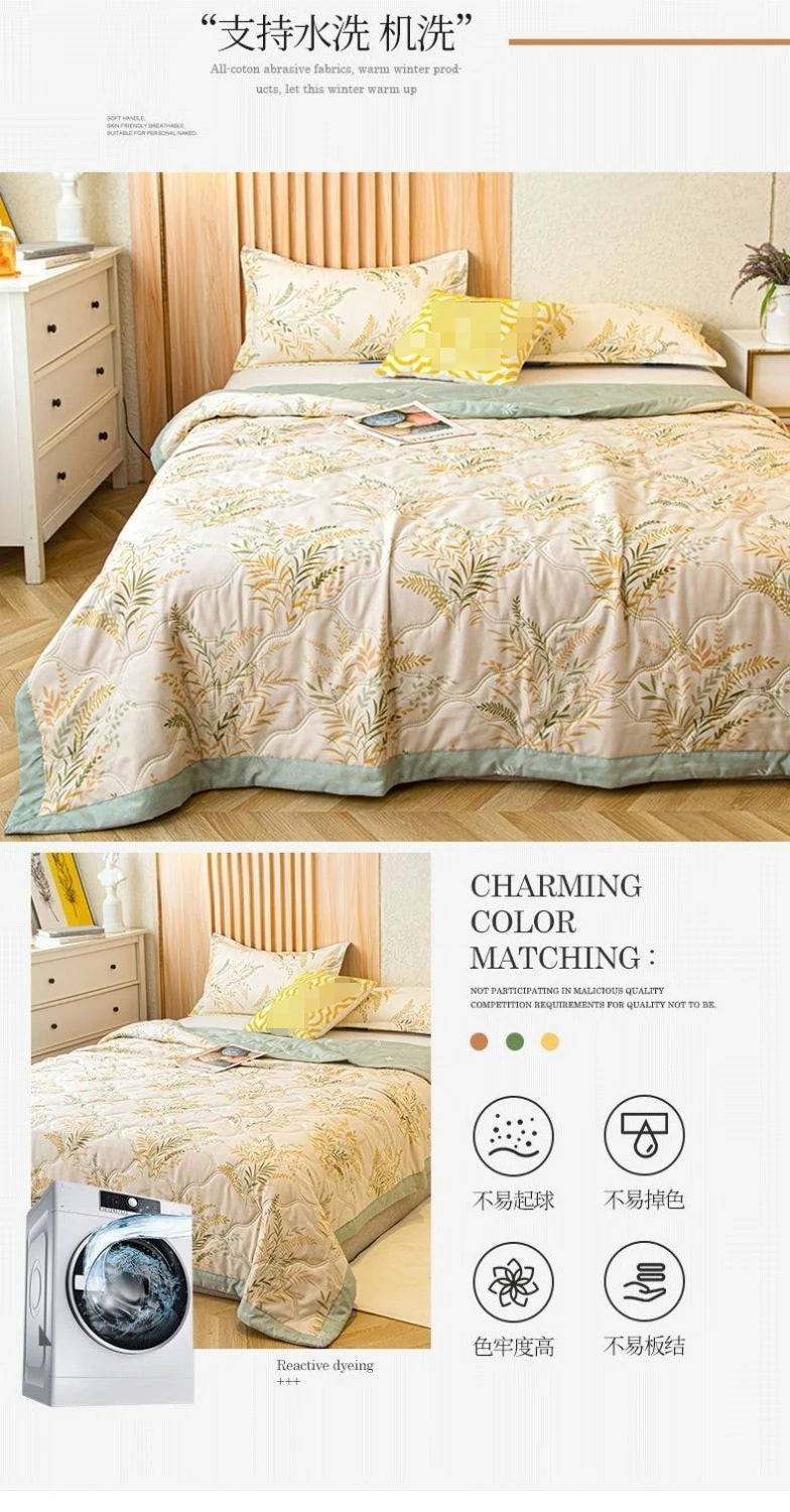 A beige patterned quilt is displayed on a bed, with laundry care symbols and fabric quality details shown below.