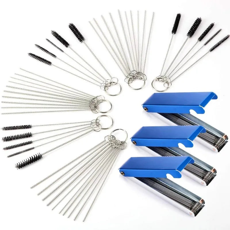 A collection of metal carburetor cleaning tools including jet needles and brushes in silver and blue.