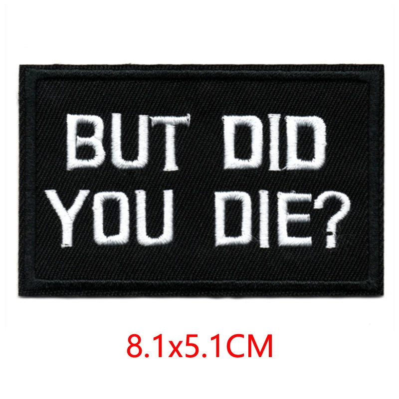 Black embroidered iron-on letter patch with white text that reads BUT DID YOU DIE?
