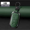 A dark green leather and metal key fob with a split ring attached, shown against a black background.